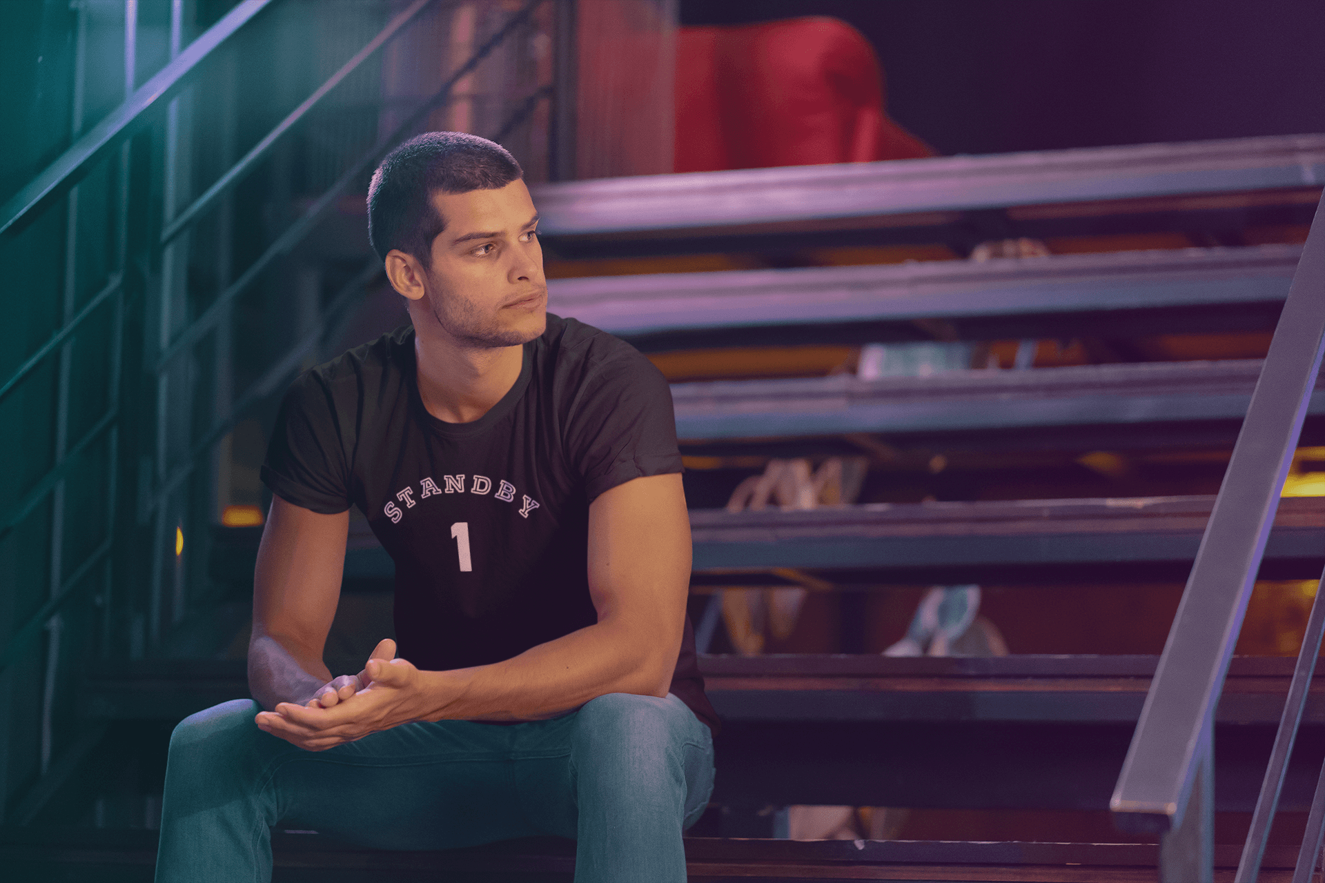 t-shirt-mockup-of-a-young-man-sitting-on-some-metal-stairs